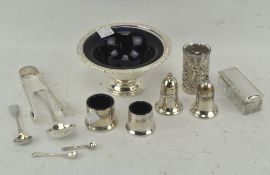 A selection of silver plated wares, including a cruet and sugar tongs,