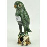 A 19th century Chinese glazed pottery figure of a Sancai parrot,