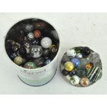 A tin of vintage marbles,