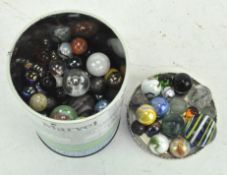 A tin of vintage marbles,