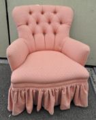 A 20th century pink button back armchair,