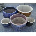 A group of five various plant pots, including blue glazed examples,