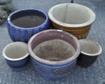 A group of five various plant pots, including blue glazed examples,