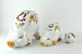 Three ceramic piggy banks,