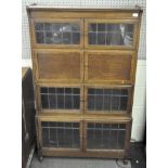 A Globe Wernike style four tier unit, three tiers being lead panel glazed,