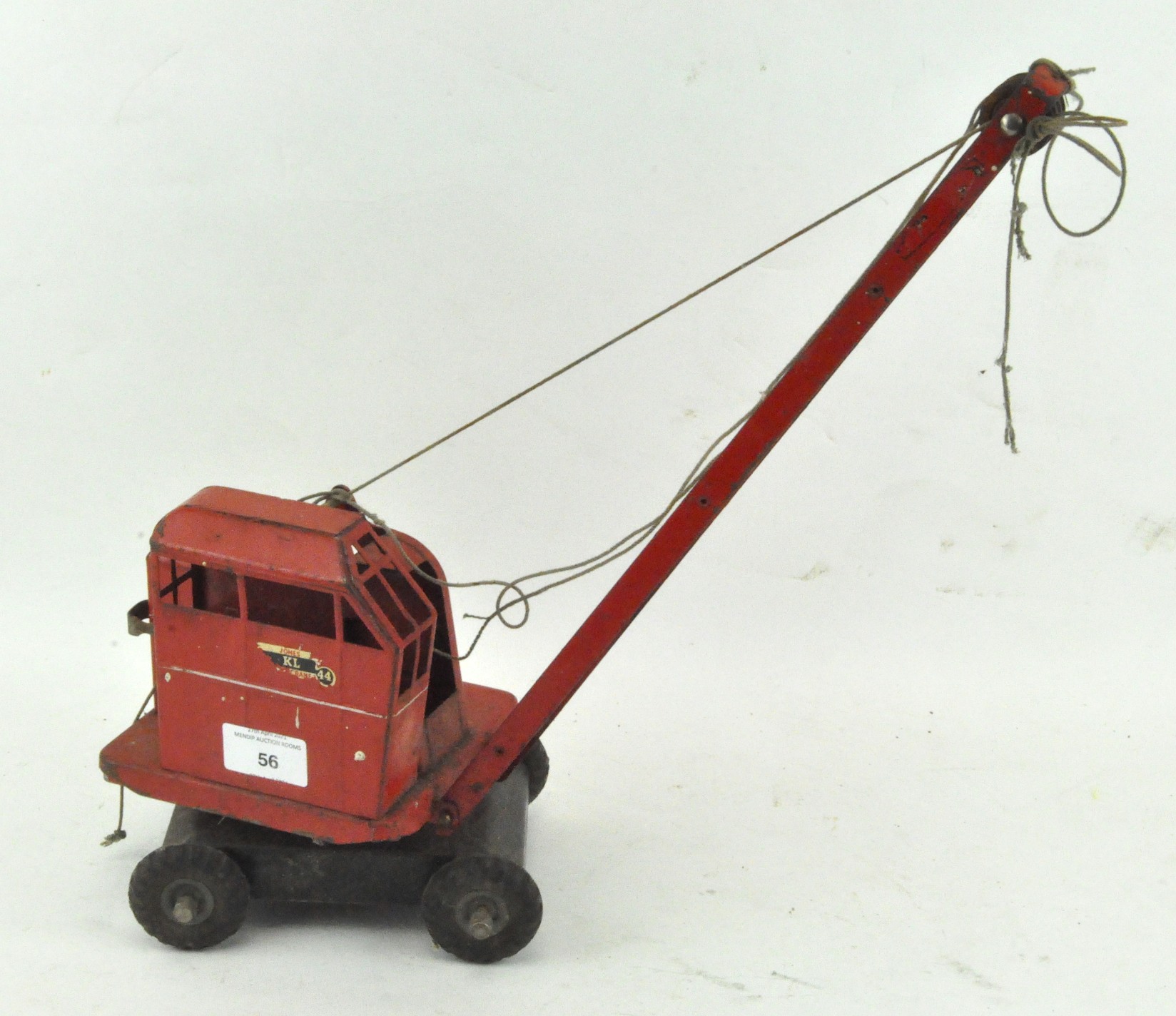 A Triang 'Jones KL44' mobile crane in red tin plate, with adjustable boom, on four wheels,