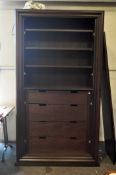 A mahogany effect two door cabinet fitted with shelves and drawers,