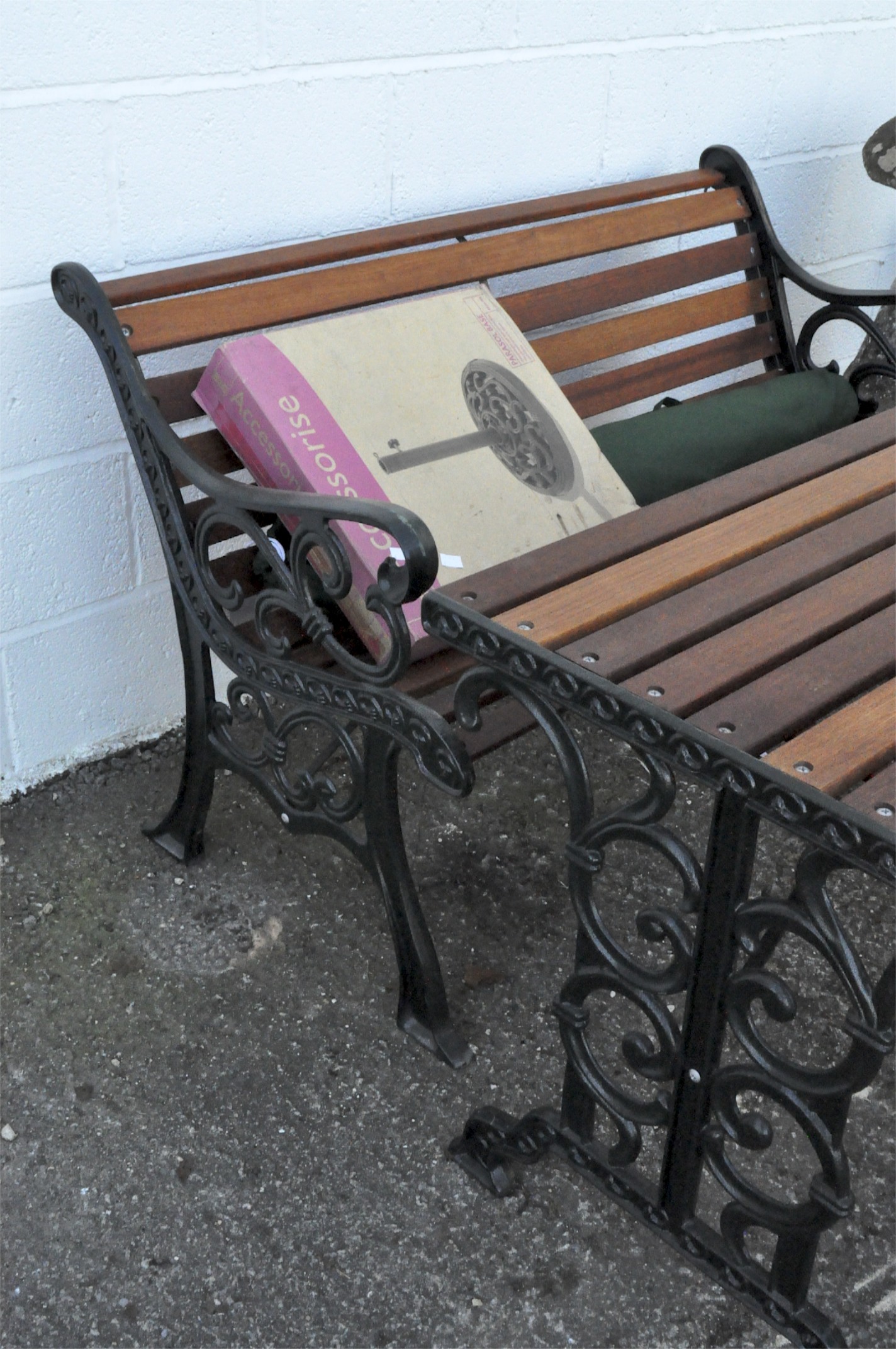 A four piece teak and cast iron garden set and a parasol stand, - Image 2 of 2