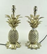 A pair of contemporary metal table lamps, in the form of pineapples, in chromed metal,