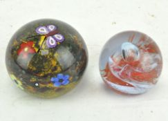 A Selkirk glass butterfly paperweight and a Caithness paperweight
