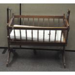 A swinging baby's cradle,