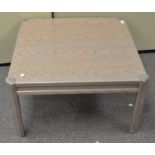 A modern coffee table of square form,