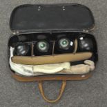 A set of four Headley Bowling Club 'Henselite' bowls together with related accessories in bag