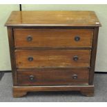 A late 19th/early 20th century walnut chest of drawers