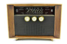 A Ferranti radio, mid-century of rectangular section, veneered and on splayed feet,