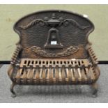 A Victorian cast iron ornate fire grate, the back adorned with urn finial,