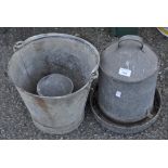 Two metal feeding troughs and a galvanised bucket,