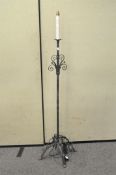 A wrought iron standard lamp,