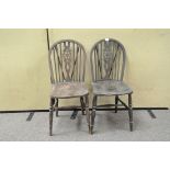 Two 20th century wheel back Windsor style kitchens chairs,