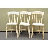 A set of three painted kitchen chairs