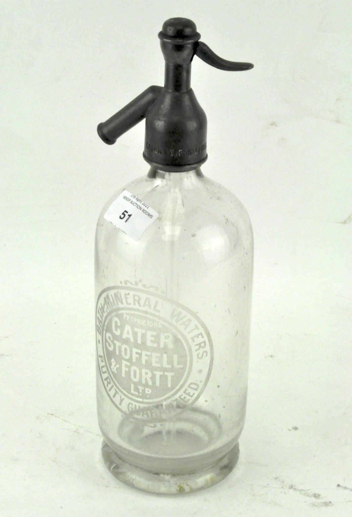 A vintage soda syphon, the glass etched for 'Cater Stoffell & Fortt Ltd/Bath Mineral Water',