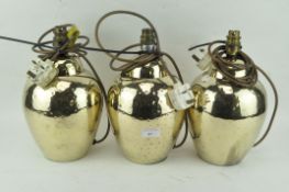 Three gilt decorated pottery table lamps by BHS,