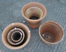 A group of assorted plant pots, including terracotta examples,