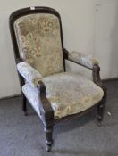 A 19th century upholstered armchair, with cushioned upholstered back, arm rests and seat,