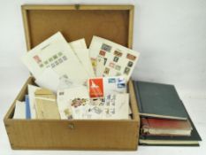 A collection of assorted worldwide stamps and related ephemera, including stamp albums,,