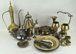 A collection of assorted brassware, including bells, a Turkish coffee-pot and domed cover,