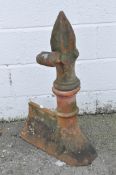 A terracotta roof finial with leaf decoration,