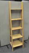 A modern set of Pine 'ladder' shelves, five tiered of graduating form,