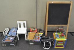 A child's chair, a blackboard, an activity toy,