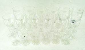 A collection of cut glass wine glasses in sizes,