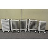 A group of five oil heaters