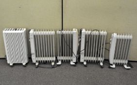 A group of five oil heaters