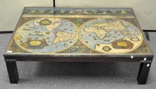A large modern coffee table, the top adorned with a map,