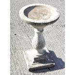 A reconstituted stone bird bath, of circular form on a square base, 44.