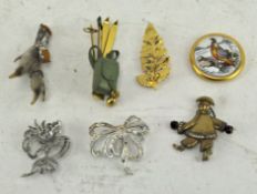 A selection of seven vintage brooches, to include a bird claw,