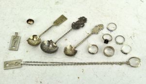 A collection of various silver and white pieces of jewellery,