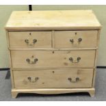 A pine chest of drawers with two short over three long drawers,