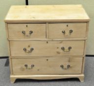 A pine chest of drawers with two short over three long drawers,