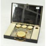 A ladies enamel and glass part dressing table set, including perfume bottles,