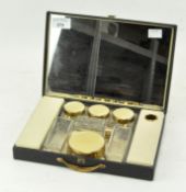 A ladies enamel and glass part dressing table set, including perfume bottles,