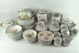 A large collection of Denby ceramics, including a tea and dinner service, including teacups,