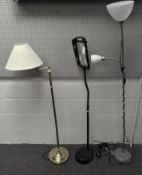 Two modern standard lamps and a magnifier,