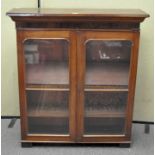 A Victorian mahogany display cabinet with glazed doors, four shelf tiers,