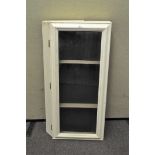 A vintage white painted glazed table top display cabinet,