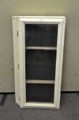 A vintage white painted glazed table top display cabinet,