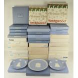 A large collection of Wedgwood Christmas plates, most being boxed,